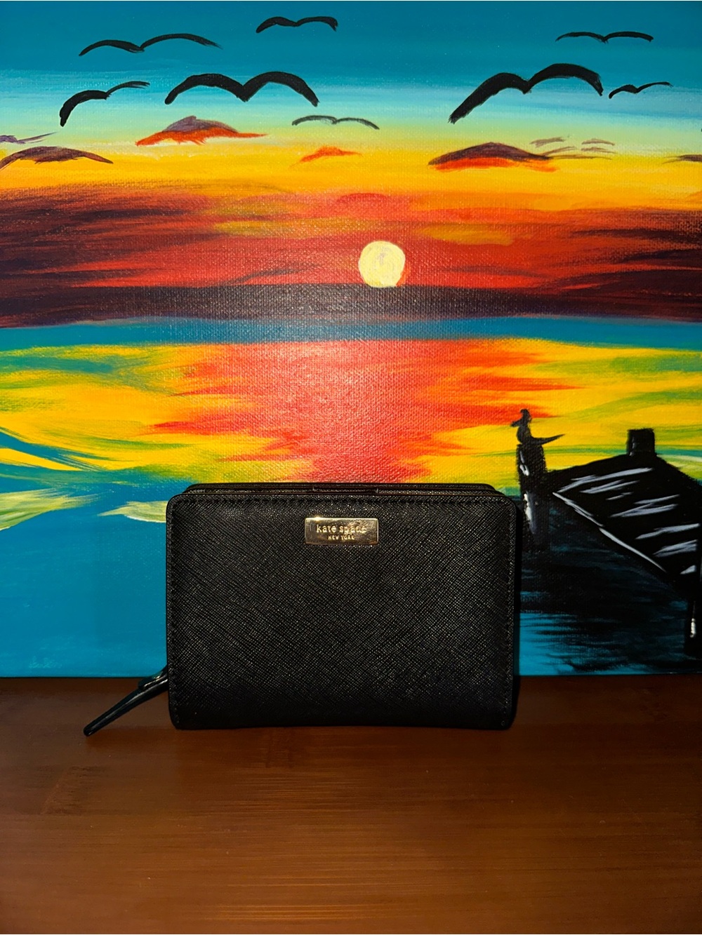 NWOT Kate Spade black saffiano zip-around wallet with gold logo